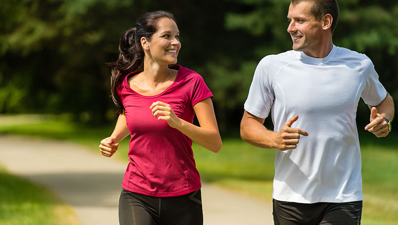 Couple jogging because of advice from a Ponderay Chiropractor at By Design Chiropractic