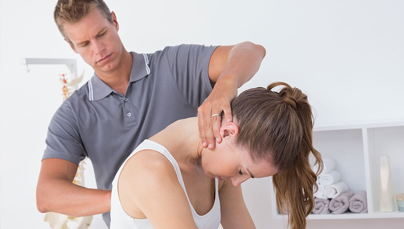 patient recieving an adjustment from a Ponderay Chiropractor at By Design Chiropractic