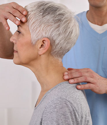 Patient receiving chiropractic adjusmtent for migraine relief from Ponderay Chiropractors