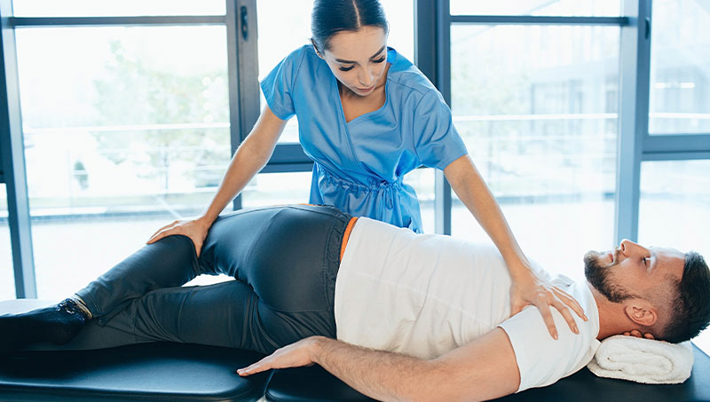 Patient being adjusted for sciatica by a Ponderay Chiropractor at By Design Chiropractic