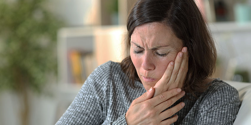 Patient suffering from TMJ in need of Chiropractic care at By Design Chiropractic in Ponderay